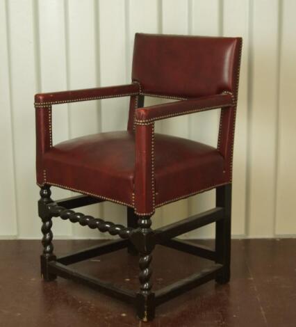 A Jacobean style upholstered open armchair