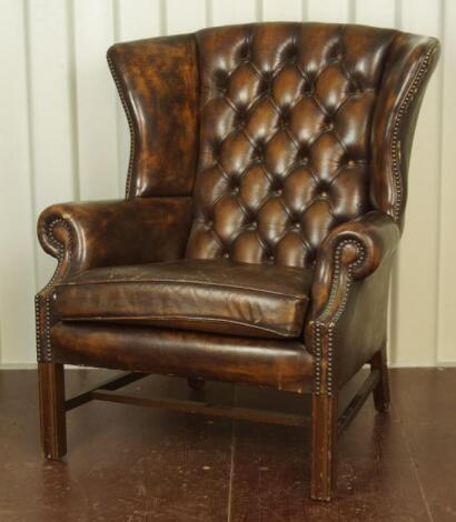 A Georgian style reproduction wing armchair