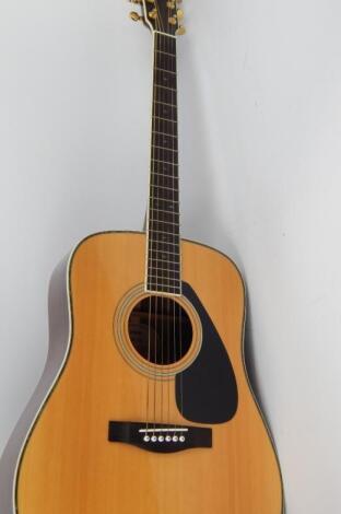 A Yamaha DW5S acoustic guitar