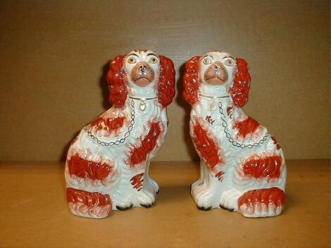 A pair of 19thC pottery Staffordshire dogs