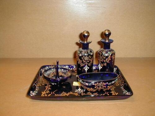 A 19thC blue glass part dressing table set