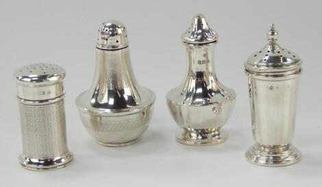 Four silver pepperettes