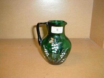 A 'Mary Gregory' green glass jug