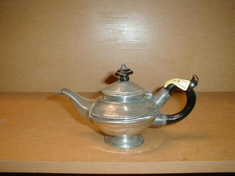 A 19thC batchelors teapot with wooden finial and scroll handle