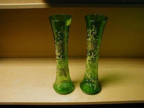 A pair of 19thC green glass vases
