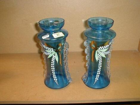 A pair of 'Mary Gregory' blue glass vases