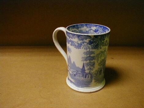 A 19thC pottery mug, circular, printed in blue with a Indian landscape,