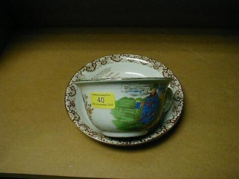 An early 20thC pottery outsized teacup and saucer