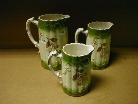 A set of 3 Staffordshire pottery graduated jugs of vertical fluted form