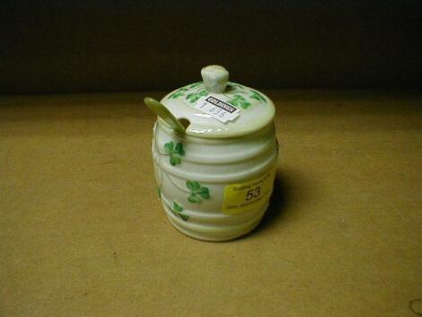 A Belleek porcelain honey-pot and cover