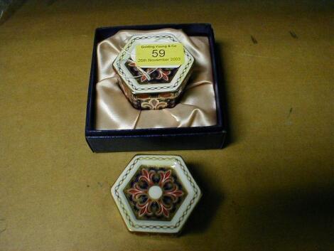 A pair of Royal Crown Derby hexagonal trinket box and covers