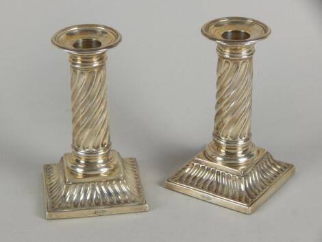 A pair of Victorian silver candlesticks