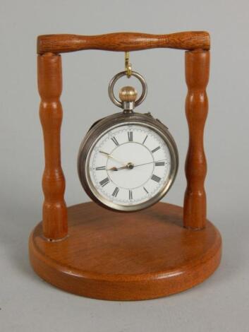 A silver open face pocket watch