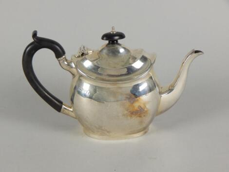 A George V silver bachelor's teapot by George Nathan & Ridley Hayes