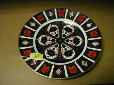 Eight Royal Crown Derby dinner plates