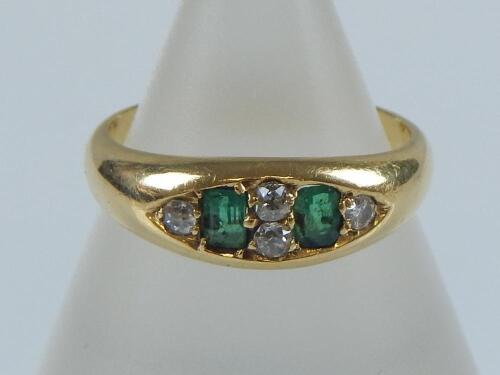 A Victorian diamond and emerald set gypsy style ring