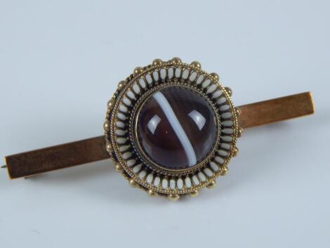 A Victorian bulls eye agate bar brooch