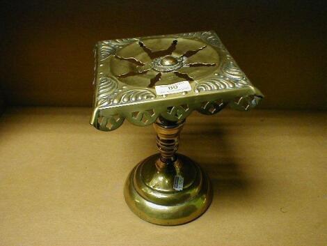 A 19thC brass trivet, with square pierced top, stamped Royal Engineers