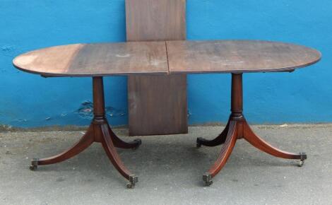 A Regency style mahogany dining table