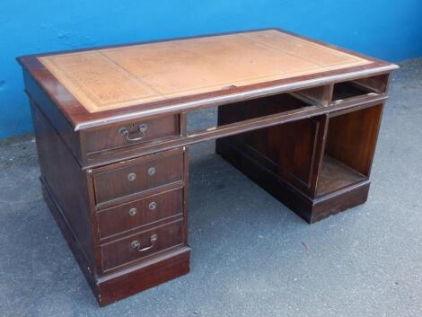 A reproduction mahogany pedestal desk