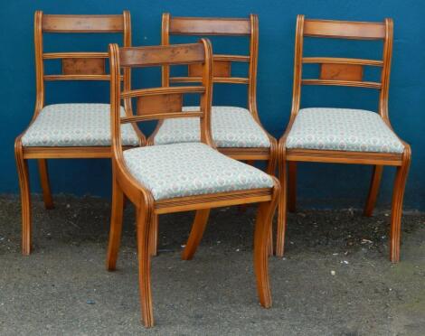 A set of four reproduction yew dining chairs