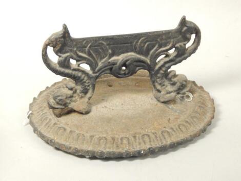 A Victorian cast iron boot scrape