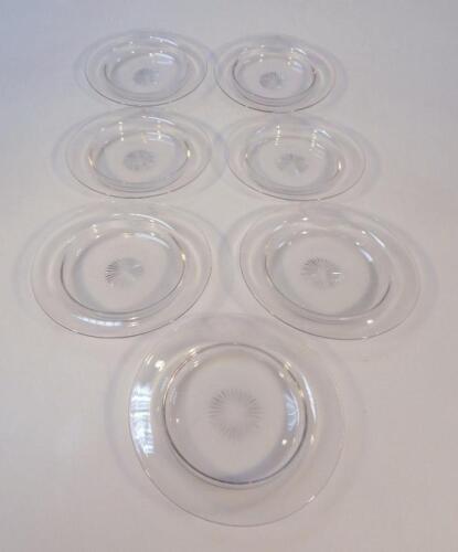 A set of seven plain cut glass and etched ice bowls