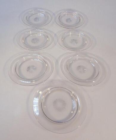 A set of seven plain cut glass and etched ice bowls