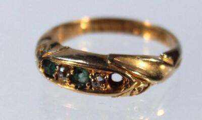 An 18ct emerald and diamond ring