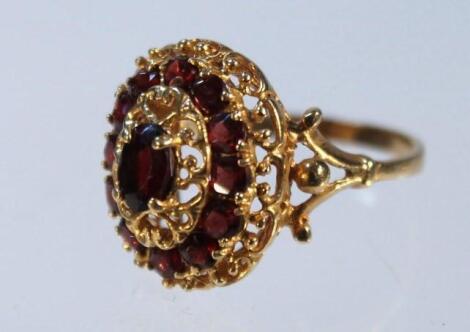 A garnet oval cluster ring