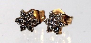 A pair of diamond cluster ear studs