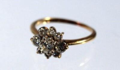 A ladies diamond nine stone cluster ring