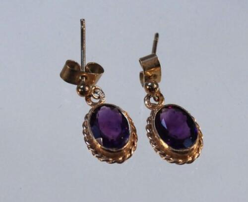 A pair of drop earrings