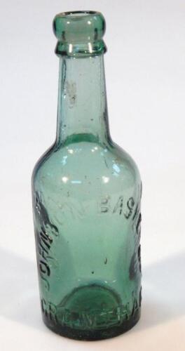 A Johnson Basker & Co. green glass bottle