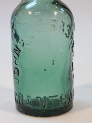 A Johnson Basker & Co. green glass bottle - 2