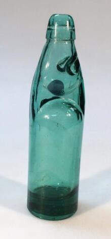 A green glass lemonade bottle
