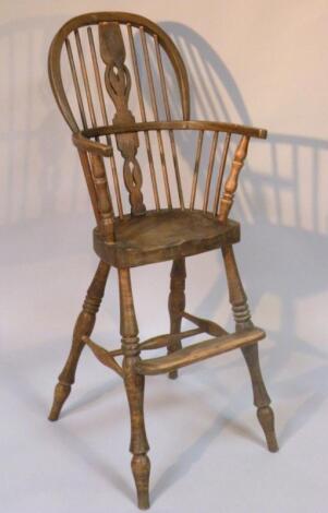 An early 20thC ash and elm child's Windsor highchair