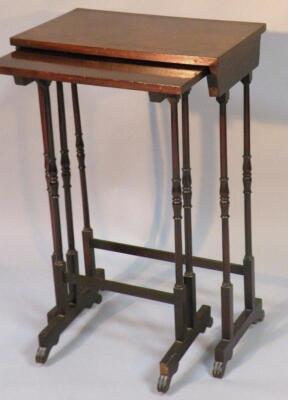 A nest of three late 19thC walnut occasional tables