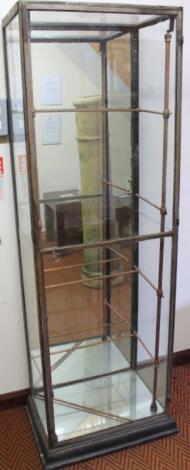 An early 20thC metal framed and glazed freestanding confectionery cabinet