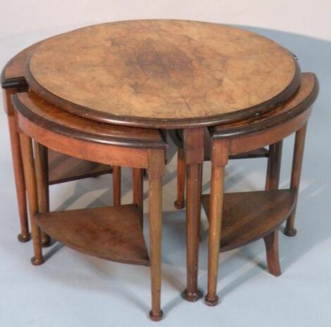 A 1930's walnut occasional nest of tables