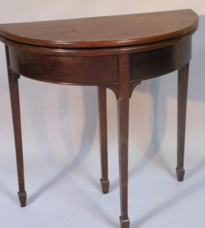 A 20thC mahogany D-end fold over games table