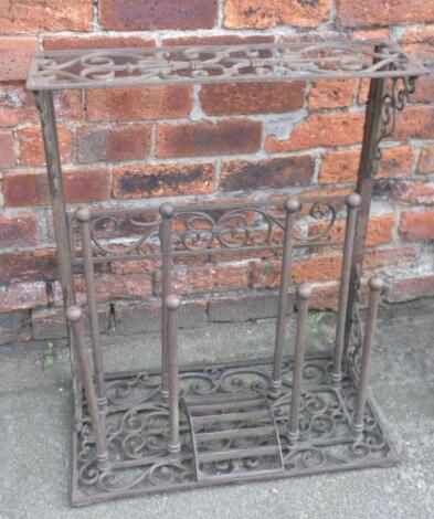 A cast iron umbrella and boot stand