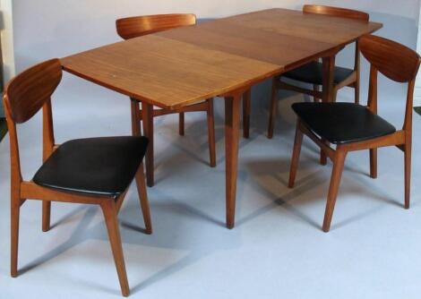 A 1960's G-plan style draw leaf table and four chairs