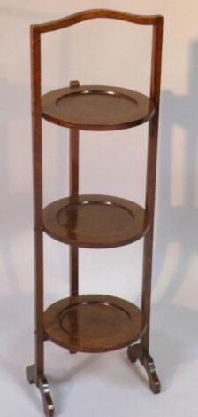 A mid-20thC mahogany three tier cake stand