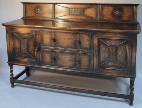 An early 20thC oak sideboard