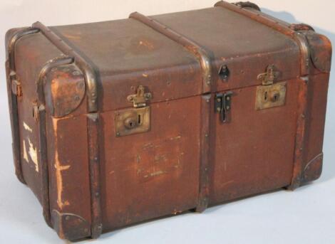 An early 20thC pressed leather and part wooden bound travel trunk