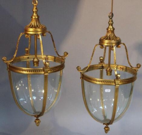 A pair of Regency style gilt metal hall lanterns