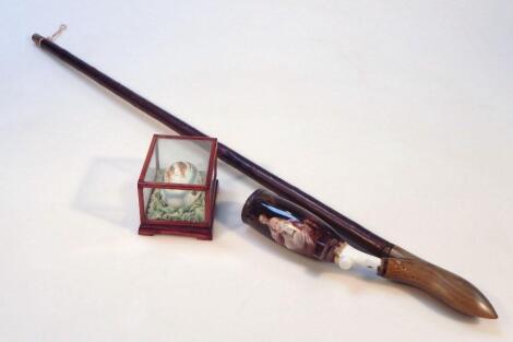 An early 20thC Continental porcelain and wooden pipe