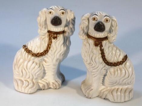 A pair of early 20thC Staffordshire pottery spaniels