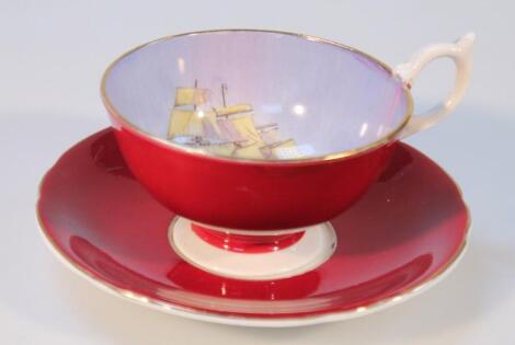 An Aynsley shipping cup and saucer